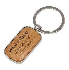 a wooden keychain with the name robert williams engraved on it's side