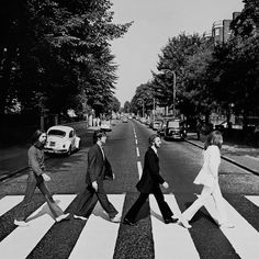 the beatles crossing the street at an intersection