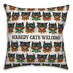 a black and white pillow with cats on it that says scared cats welcome in front of the image