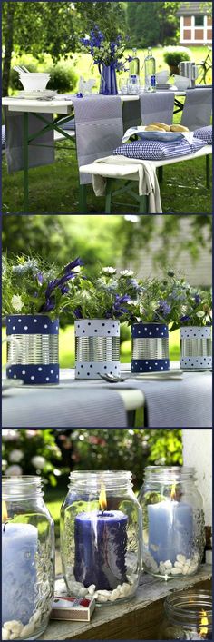 the table is set up with candles and flowers in mason jars on it, along with other decorations