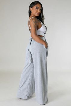 Stay cool, chic, and comfy all day in our Casual Sweatpant Jumpsuit. With a cool suspender-style look and wide legs, this jumpsuit takes casual to the next level. Perfect for everyday wear, you'll never want to take it off. pictured top is not part of the purchase Casual Wide Leg Jumpsuits And Rompers For Loungewear, Casual Wide-leg Jumpsuit For Loungewear, Wide Leg Solid Color Jumpsuits And Rompers For Loungewear, Gray Cotton Jumpsuits And Rompers For Loungewear, Casual Gray Sleeveless Jumpsuits And Rompers, Casual Full Length Solid Jumpsuits And Rompers, Casual Wide Leg Loungewear Overalls, Cotton Wide Leg Jumpsuits And Rompers For Loungewear, Casual Wide-leg Overalls For Loungewear