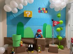 a nintendo themed room with balloons and decorations