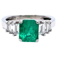 LOVE this Classic Vintage Natural Emerald Engagement Ring! Crafted in Platinum, the engagement ring features an Emerald Cut Natural Emerald, approximately 1.50ct in weight, of excellent quality. The deep, rich green color of this Emerald is just perfect! It's flanked a total of Six Baguette Cut Diamonds, totaling 0.72ct, of G/VS2 quality! Other Important Details: The ring is a Size 5.5. The ring is not stamped, but has been tested to be Platinum. The rings weigh 6.8 grams. The total carat weight White Gold Emerald Ring, Gold Emerald Ring, Rings Green, Sapphire Cocktail Ring, Baguette Engagement Ring, Diamond Gold Ring, Green Emerald Ring, Emerald Blue, Emerald Ring Gold