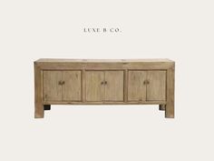 the sideboard is made out of wood and has four doors on one side, two drawers