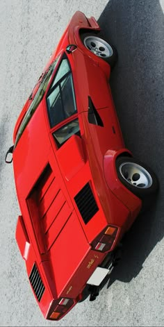 an overhead view of a red sports car