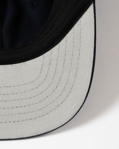 Description Size & Fit Care Shipping & Policies The Rue Cap features an unstructured, low-profile crown and flat brim with a contrast grey under-brim inspired by on-field baseball caps from the 1990s. Made from organic cotton twill. Designed, cut, and sewn in Canada.Fit: One size fits mostDetails: Six-panel, unstructured, low-profile crown, sewn eyelets, tonal stitching, slide clasp back closureMaterial: 100% organic cottonOrigin: Made in CanadaAlso available in Black and Natural. One size fits Pop Up Store, The 1990s, Product Ideas, Ball Cap, Baseball Caps, Low Profile, Cotton Twill, Unisex Sweatshirt, Organic Cotton