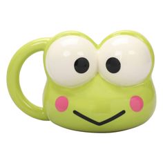 a close up of a green mug with eyes