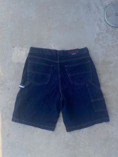 Vintage 1990s Tommy Hilfiger Jorts - Size 34 - Good vintage condition (no holes no stains) - Message for more information Please take note of the measurements listed as these are vintage clothes and may fit different than the tag size. Follow our page for more vintage clothing drops! Connect with us on Instagram: @recurarchives Vintage Dark Wash Cargo Bottoms, Vintage Dark Wash Bottoms With Cargo Pockets, 90s Style Denim Blue Bottoms With Pockets, Vintage Jean Shorts With Pockets For Streetwear, 90s Denim Blue Jean Shorts For Streetwear, 90s Style Dark Wash Bottoms For Streetwear, Short Leg Jeans With Pockets For Streetwear, 90s Denim Blue Shorts With Pockets, 90s Style Relaxed Fit Jean Shorts With Pockets