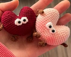 two small crocheted hearts held in someone's hand