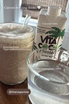 the ingredients for coconut water are displayed on a table next to a glass bowl and carton of milk