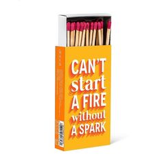 an orange box with matches in it that says can't start a fire without a spark