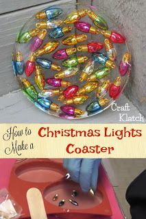 a glass bowl with christmas lights in it sitting on top of a pink tray next to a wooden spoon