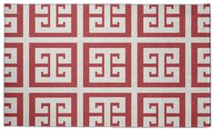 a red and white area rug with an interlocked design on the front side