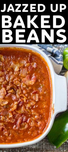 a white bowl filled with baked beans next to green peppers and jalapenos