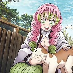 a woman with pink hair sitting next to a cat