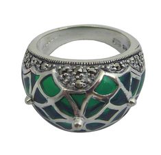 *    Delivered in a presentation box with certificate of authenticity. *    Unique and dramatic, this decorative and intricately crafted women's ring is inspired by the gothic era of past decades. This collectable design offers striking sterling silver lines and marcasite stones set        around the edge. *    92.5% silver ring with green enamel. *    Crafted from Hallmarked sterling silver. *    A beautiful women's ring. *    Available in sizes: K, P & R Gothic Era, Silver Gift Wrap, Round Locket, The Gothic, Silver Line, Gifts For My Wife, Gorgeous Bracelet, Green Enamel, Art Deco Ring