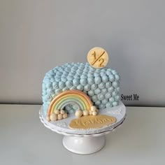 there is a cake that looks like it has a rainbow on top