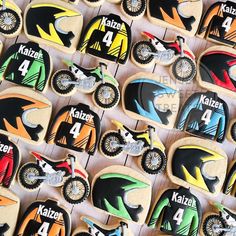 cookies decorated like dirt bikes are displayed for sale