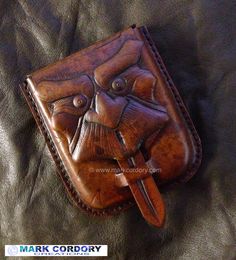 a leather case with a face on it