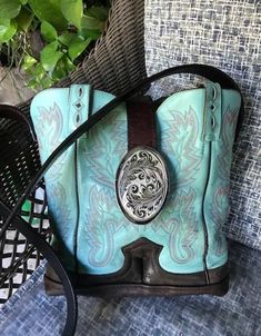 Popular Turquoise Cowboy Boot Purse. Made from gently used cowboy boots, Gently used leather belt for strap, new buckle, snap closure and lined with beige waterproof canvas for easy clean. Body of purse is 10" high by 10" wide at top Cowboy Boot Repurpose Ideas, Turquoise Cowboy Boots, Boot Purse, Cowboy Boot Purse, Broken Arrow, Clean Body, Cowboy Boot, Easy Clean, Repurpose