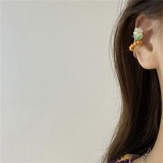 Discover the perfect blend of fun and floral with our "Floral Ear Cuff Set". This set includes three beautifully designed ear cuffs that can be worn without any piercings, offering a stylish and pain-free way to accessorize your ears. Each set features vibrant flower designs and comes in a variety of matching colors, allowing you to mix and match for any occasion. Ideal for those who love playful and colorful accessories, the Floral Ear Cuff Set adds a unique touch to your look. Whether you're dressing up for a special event or adding a pop of color to your everyday style, these ear cuffs are sure to draw attention and compliments. Made for easy wear and comfort, these ear cuffs are designed to stay securely in place without the need for piercings. Embrace the joy of floral and fun fashion Ear Accessories, Colorful Accessories, Matching Colors, Vibrant Flower, Ear Cuffs, Fun Fashion, Hair Claws & Clips, Pain Free, Girl Backpacks