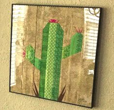 a painting of a cactus on a wall