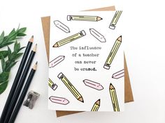 a card with pencils and writing on it next to some crayon markers