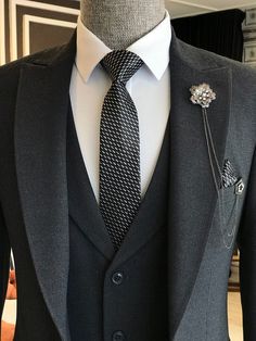 Color: Dark Grey Material: 49% Polyester, 49% Viscose, 2% Elastane Suit includes blazer, waistcoat & trousers Single-breasted suit (1 button blazer) Lapel type: peak lapels Jacket interior lining option: fully-lined Jacket Vent: Double Vent Fitting: slim-fit Care instructions: dry clean only Machine washable: no