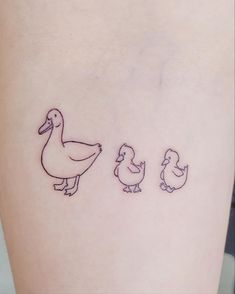 three ducks and one duckling tattoo on the right side of the leg, which is drawn in black ink