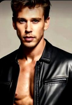 a shirtless man in a black leather jacket