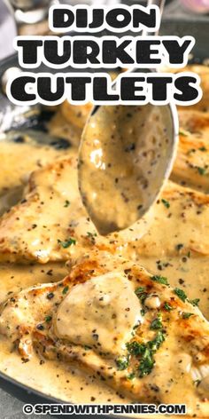 a pan filled with chicken covered in gravy and being spooned into it