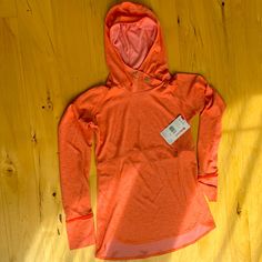 Lightweight Hoodie For Hiking, Running, And Training Coolexchange Technology Offers Sweat-Activated Cooling Sweat-Wicking Fabric Helps You Stay Dry And Cool Engineered Vents For Improved Breathability Raglan Sleeves Allows Better Range Of Motion Flatlock Seams Minimize Chafing And Irritation Secure Zippered Pocket For Keys Or Wallet Orange Hooded Sporty Top, Sporty Orange Hooded Top, Long Sleeve Tops For Light Sports In Spring, Spring Long Sleeve Tops For Light Sports, Cowl Pullover, Mock Neck Sweatshirt, Cowl Neck Sweatshirt, Red Pullover, Quarter Zip Sweatshirt