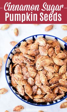 cinnamon sugar pumpkin seeds in a blue bowl on a white table with text overlay