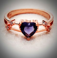 Amethyst Heart 14K Rose Gold Ring w/ White Sapphires Double Band Sweet double band ring featuring a stunning .55 carat amethyst heart accented with dazzling small white sapphires. These exquisite gemstones are lab created giving you the flawless brilliance of the finest genuine gemstones - but at a fraction of the cost. The setting is 14k rose gold over sterling silver, marked S925. This was from an estate featuring jewelry originating from Scandinavia. It's in excellent condition; appears to be Valentine's Day Gift Amethyst Ring With Accent Stones, Rose Gold Amethyst Ring With Prong Setting For Gift, Elegant Amethyst Heart Promise Ring, Rose Gold Amethyst Ring With Prong Setting, Gift Rose Gold Amethyst Ring With Prong Setting, Valentine's Day Amethyst Promise Ring, Heart Shaped Amethyst Ring For Valentine's Day Gift, Heart-shaped Amethyst Ring For Valentine's Day, Elegant Amethyst Heart Ring For Gift