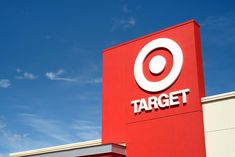 a target store sign on the side of a building with blue sky in the background