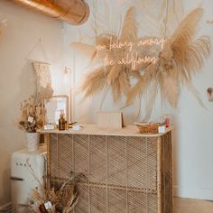 a display with feathers hanging from the ceiling