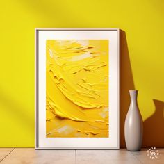 an abstract painting is displayed in front of a yellow wall with a vase on the floor