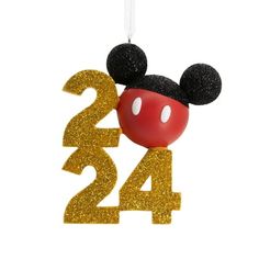 a mickey mouse ornament with the number twenty four on it's head