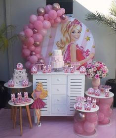 a barbie birthday party with pink and gold decorations