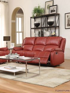 a living room filled with red leather furniture