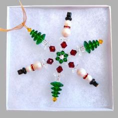 a snowflake ornament made out of glass beads