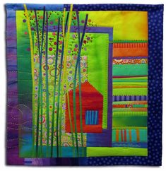 an art quilt with colorful designs on it