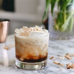 an iced drink sitting on top of a marble table