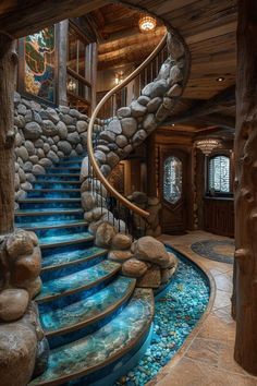 a spiral staircase with rocks and water running down the sides, leading to a second story