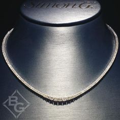 Simon G. 18K White Gold 17.5 Inch Graduating Diamond Riviera Necklace Featuring 3.55 Carats of Round Cut White Diamonds Necklace measures 17.5 inches long x 1/16 inches wide at its widest point and tapers down to 1/8 inches at it's narrowest point Diamonds are VS2 clarity and F/G color Includes necklace box Includes jewelry appraisal Ships fully insured to point of delivery All orders placed out of NY state (ordered by an out of state resident) are tax free Formal Diamond Tennis Necklace With Pave Setting, Formal Diamond White Tennis Necklace With Pave Setting, Elegant Tennis Necklace With Pave Setting For Anniversary, Diamond Tennis Necklace With Pave Setting For Formal Occasions, Formal Silver Tennis Necklace With Pave Setting, Silver Tennis Necklace With Pave Setting For Formal Occasions, Formal Solitaire Necklace With Pave Setting, Classic Formal Diamond Necklace With Pave Setting, Classic Diamond Necklace With Pave Setting For Formal Occasions