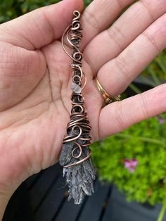 Black Kyanite Witches Broom Pendant wire wrapped in Oxidized Copper This is an Black Kyanite Witches Pendant with a moonstone accent. Wrapped in a swirly oxidized copper design. It has been polished and will need a good polish every once and a while. This is the only one of its kind. Comes with a chain to match the copper color. Will have a polish cloth in the box and sealed ready for gift giving. Makes a great gift or something to treat yourself! Very nice necklace. Great for Halloween! It will come in a box ready to be given as a gift. Thank you for visiting MunchkinsCreationsCA Gemini Jewellery part of the Wings and Things Shop! Witch Broom Jewelry, Wire Wrapped Witches Broom, Wire Wrapping Ideas, Halloween Wire Wrapped Jewelry, Kyanite Broom, Afro Jewelry, Gemini Jewelry, Black Kyanite, Witch Pendant