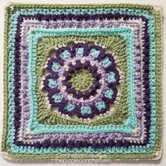 a crocheted square is shown with the center in purple and green, as well as