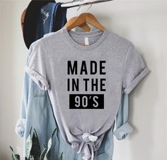 "Made in the 90s Shirt,Funny 1990s Birthday Shirt,90s Birthday Gift,Born in the 90s,Retro 90s Shirt,90s T-Shirt,90s Birtday Party,1990s Tee ----- How To Order ----- 1-) Please, check and review all the photos. 2-) Choose your t-shirt size and color. *Different styles of shirts may have different shades of same color choice due to different manufacturer brands. *For this reason, we recommend you to match shirts from the same styles if you want precisely matching colors (ex. Unisex, V-necks, Toddl 90s Inspired Graphic Print Birthday T-shirt, 90s Inspired Graphic Print T-shirt For Birthday, 90s Inspired Graphic Print T-shirt For Birthdays, 90s Letter Print Tops For Birthday, 90s Inspired Summer Birthday T-shirt, 90s Inspired Crew Neck T-shirt For Birthday, 90s Inspired Letter Print Top For Birthday, 90s Inspired Graphic Print Tops For Birthday, 90s Summer Birthday Tops