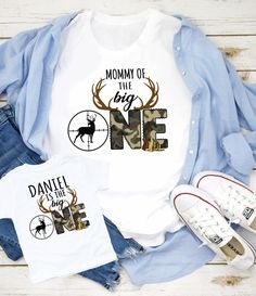 two shirts with the words mommy of the big one and deer antlers on them