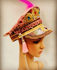 This is a hand crafted individual captain hat oozing with character and detail.  It has pearls, gems, trim , feather and chain to name a few. This is a size 59cm fits most heads comfortably. Any creases and markings are deliberate and not a defect. This is a must have accessory to set off any outfit. Every hat is unique one off and made with love. Thank you for looking Burningman Festival, Bride Hat, Burning Man Outfits, Movie Magazine, Festival Hat, Military Hat, Costume Hats, Burning Man, Gothic Fashion